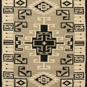 Black, cream, and light gray flat woven rug featuring a geometric pattern and wide decorative border.