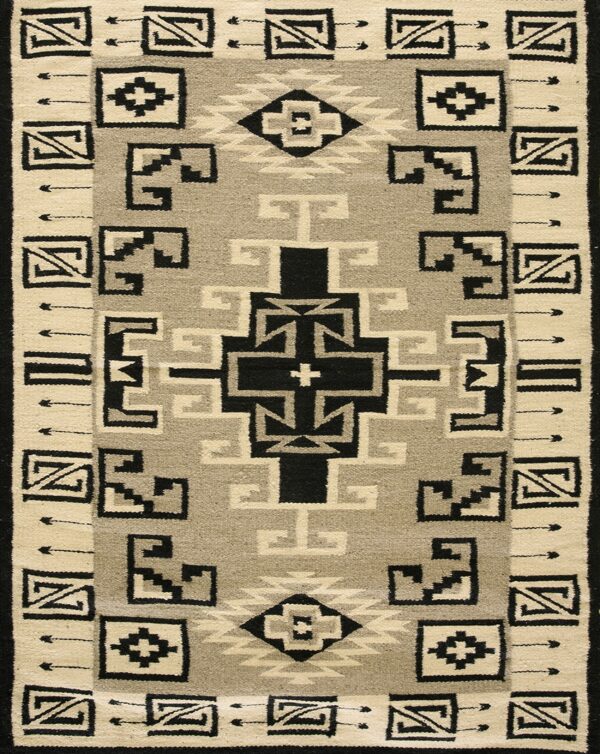 Black, cream, and light gray flat woven rug featuring a geometric pattern and wide decorative border.