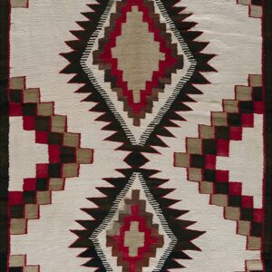 Cream geometric rug with serrated central diamond shapes and stepped side borders in red, black, and tan.