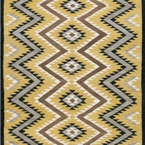 Mustard yellow rug with large brown, grey, white, and black serrated geometric diamond patterns.