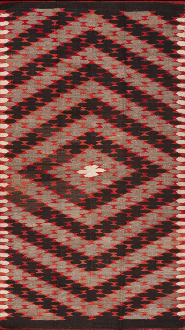 Geometric flatweave rug featuring nested diamond shapes in black, gray, red, and white.