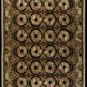 Ornate black area rug densely patterned with golden vines, floral urns, and repeating botanical wreaths.