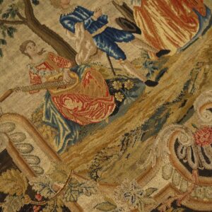 Detailed low-pile textile featuring a classical scene of figures, trees, and elaborate gold and brown scrollwork.