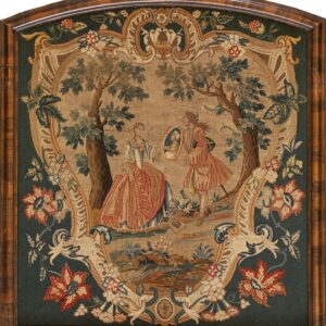 Low-pile framed textile featuring two figures in a tan wooded scene bordered by dark green floral scrollwork.