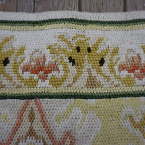 Colorful floral needlepoint rug detail