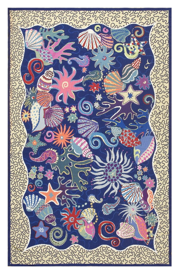 Navy rug featuring brightly colored starfish, shells, and coral surrounded by a wavy beige border with squiggly lines.
