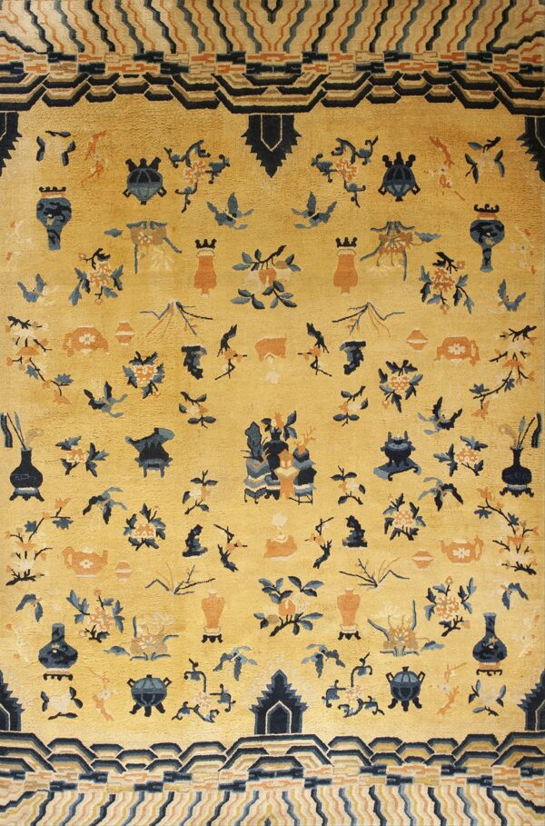 Yellow high-pile rug with scattered blue and rust vases, flowers, and figures, surrounded by geometric borders.