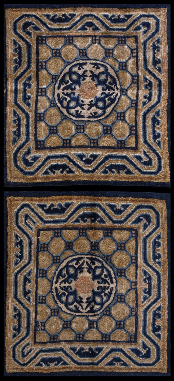 Two matching low-pile rugs in tan and navy blue with a detailed octagonal field pattern.