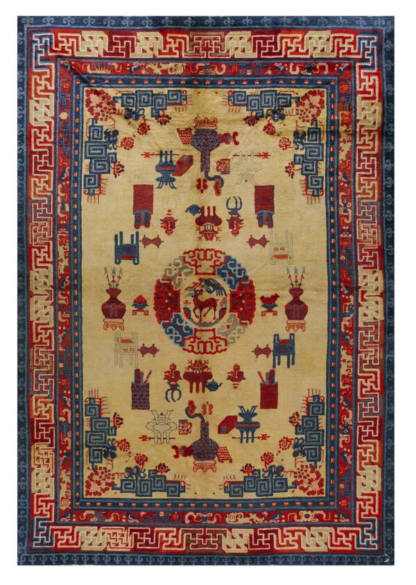 A yellow field rug with red and blue symbolic patterns, detailed with intricate geometric fret borders.