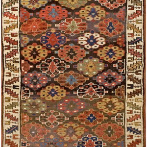Geometric runner rug with deep red, blue, gold, and green medallions on a dark brown background and thick cream border.