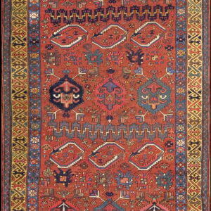 Geometric runner rug with a brick red field, diverse motifs, and intricate yellow and blue borders.