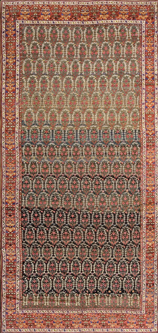 Ornate traditional rug featuring dense pink and white patterns on a dark ombre field and a wide red border.