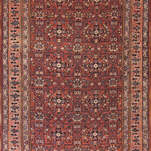 A long runner rug features a dense floral and geometric pattern in rust, navy, and gold tones.