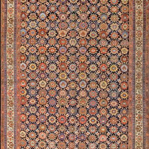 A long runner rug featuring a dark field filled with small, colorful repeating floral and geometric designs.
