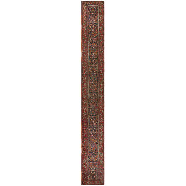 Long runner rug featuring an intricate floral pattern with a dark blue center and wide red borders.