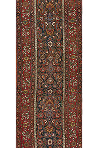 Long runner rug featuring an intricate floral pattern with a dark blue center and wide red borders.