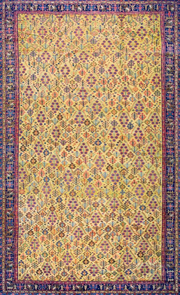 Colorful intricate patterned yellow rug