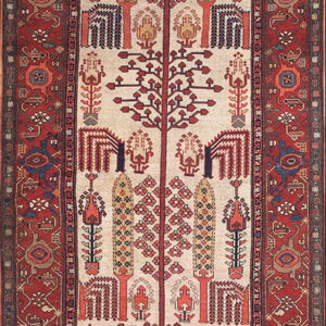 Cream runner rug with repeating red, blue, and gold stylized tree patterns and a detailed red border.