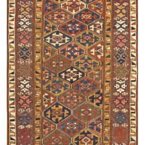 Geometric runner rug featuring a pattern of red, navy blue, and gold hexagons surrounded by rich brown borders.