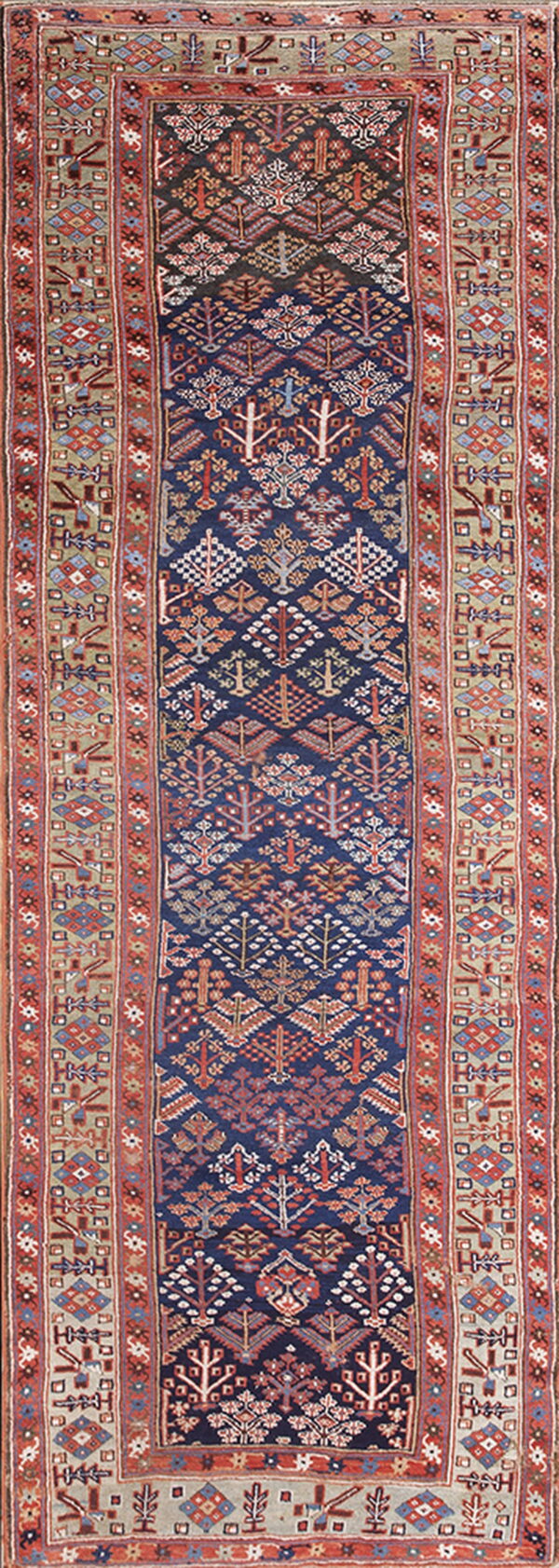 Low-pile runner rug featuring dense geometric tree patterns on a navy blue field with rust and tan borders.