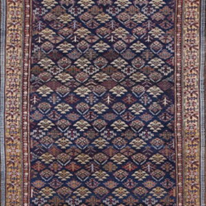 Traditional navy blue runner rug with an all-over patterned field and complex multicolored borders.