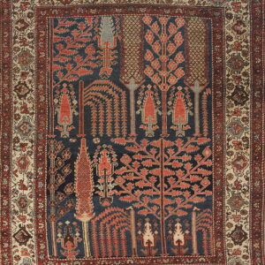 Textured rug featuring dark blue field with red geometric trees and a complex patterned beige border.