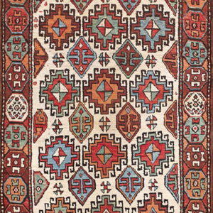 Ivory geometric rug with red, blue, and orange motifs and a border of repeating octagonal medallions.