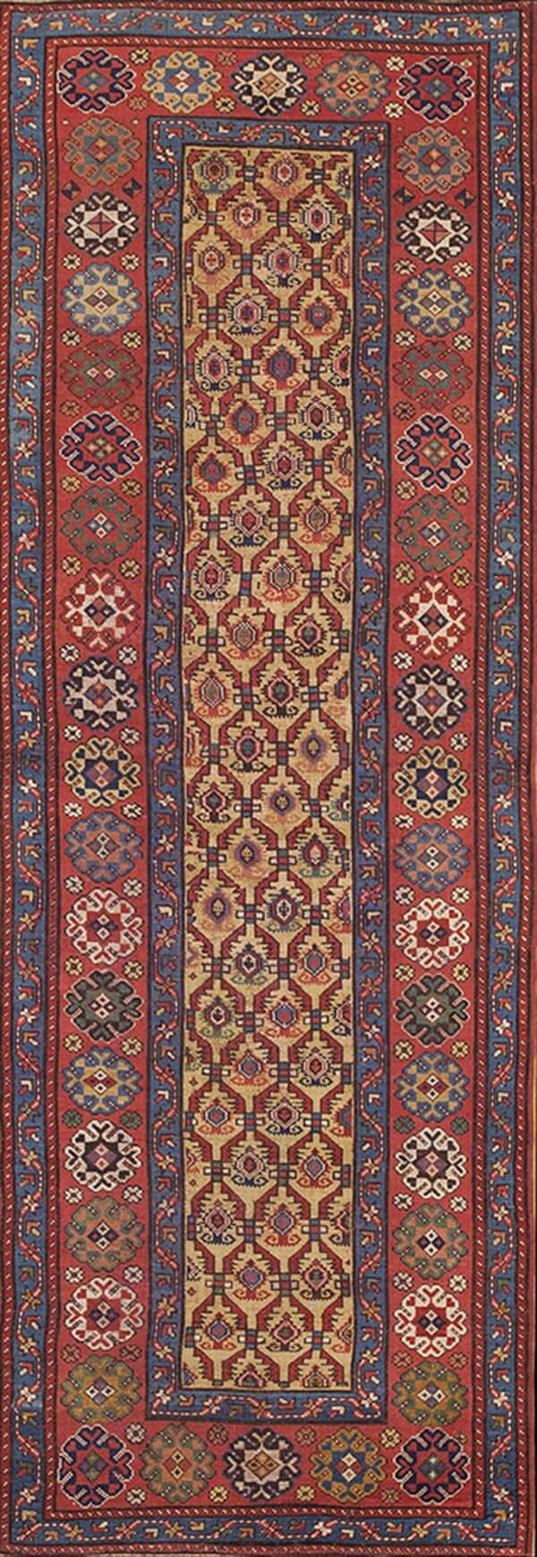 Geometric runner rug with a tan center pattern, contrasting red borders, and detailed blue and multicolored tribal motifs.