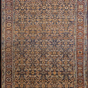 Narrow runner rug displaying dense gold and beige floral motifs on a dark blue ground, framed by rust borders.
