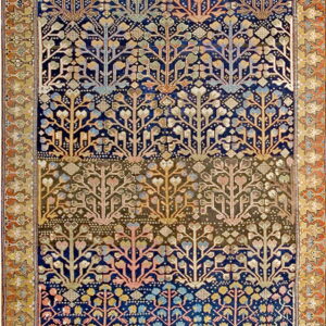 Woven rug with a dark blue and brown field showing rows of stylized multicolored tree patterns.