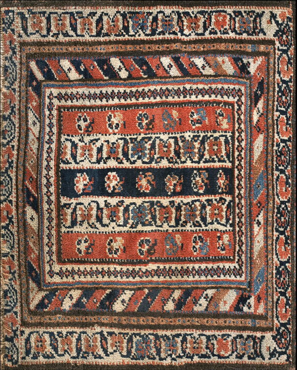 Rust and navy tribal rug featuring horizontal medallion bands framed by geometric borders.