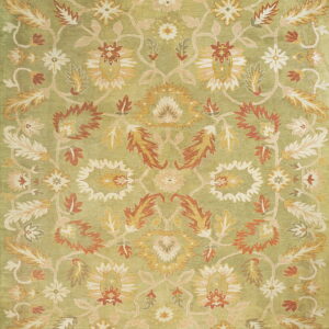 Sage green rug featuring an ornate traditional pattern of terracotta, cream, and gold botanicals.