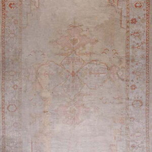 A distressed rectangular area rug featuring a faded traditional pattern in pale gray and muted rust orange.