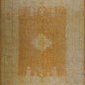 Low-pile rug with a burnt orange field and pale yellow traditional border and medallion pattern.
