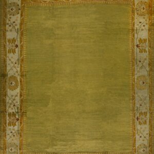 Textured olive green rug with a wide, decorative border featuring pale yellow, cream, and maroon floral designs.
