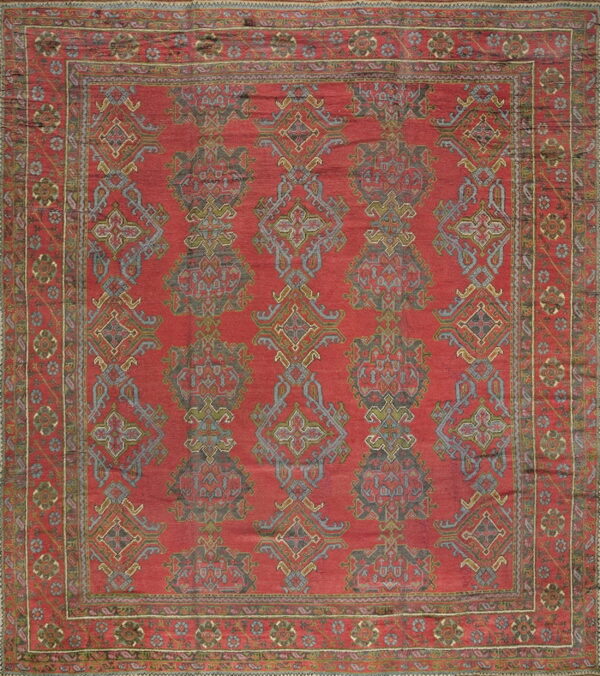 Vibrant red antique turkish rug design.