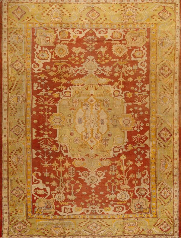 Red and gold traditional rug featuring a detailed central medallion and wide, patterned borders.