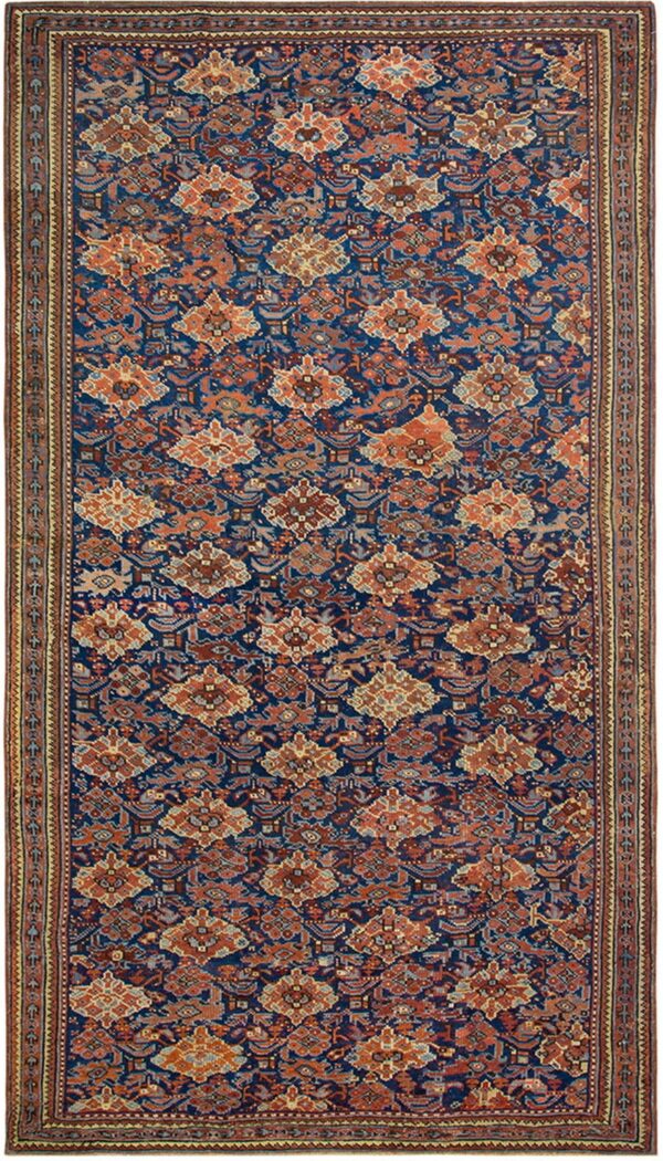 Navy blue runner rug with a repeating pattern of rust orange and brown stylized geometric figures.