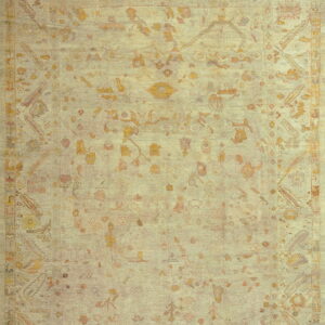 Faded ivory rug with intricate patterns.