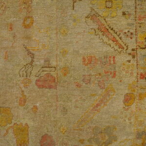 Faded floral patterns on textured rug