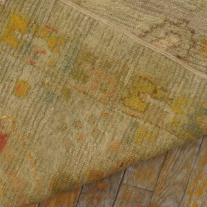 Faded floral pattern on textured rug