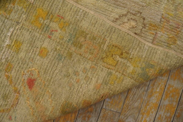 Faded floral pattern on textured rug
