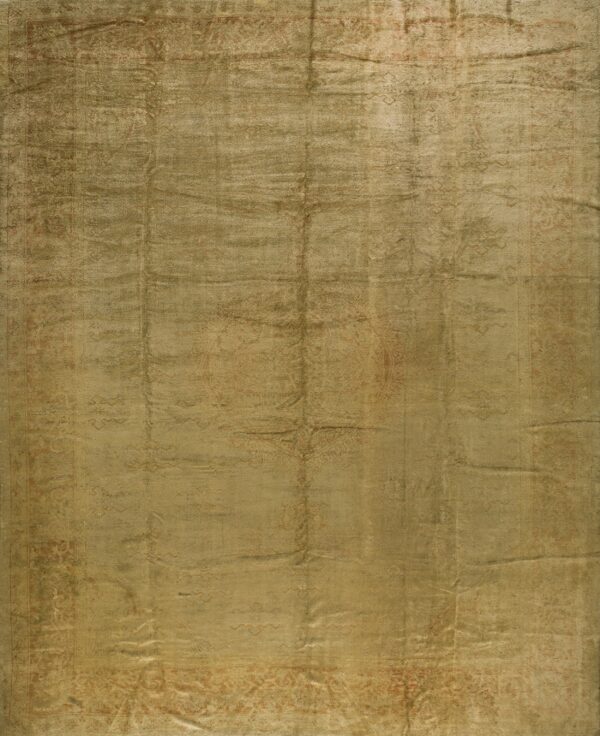 Low-pile rug in lustrous olive and gold tones displaying a faded traditional medallion pattern.