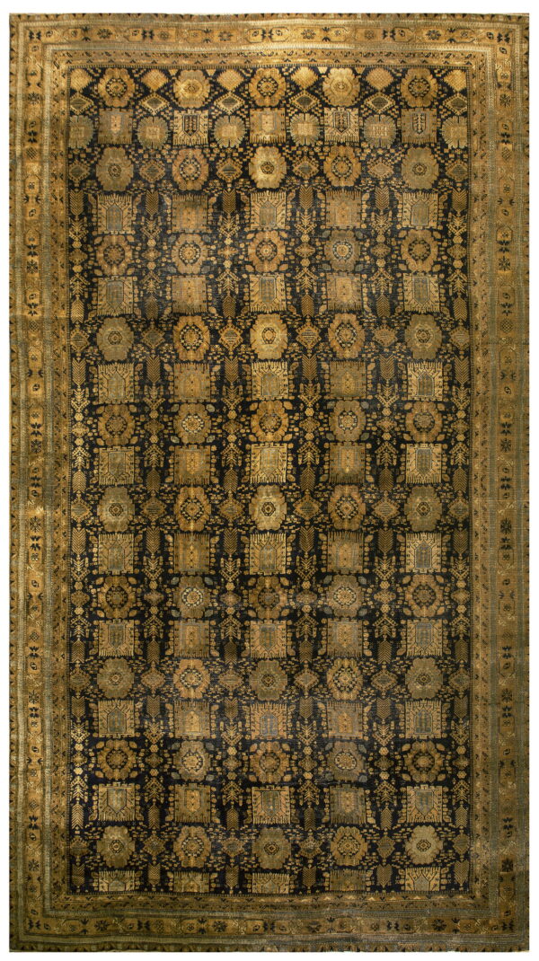 Rectangular rug featuring a dark navy field with repeating gold geometric and tribal designs.