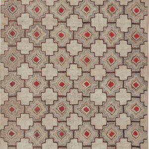 Geometric beige and brown rug featuring an interlocking lattice pattern with bright red diamond accents.