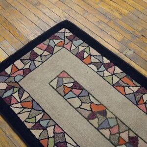 Colorful rug on wooden floor.