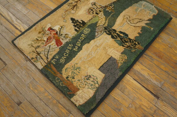 Beige and green pictorial rug featuring a bird, text, and architecture, resting on rustic hardwood planks.