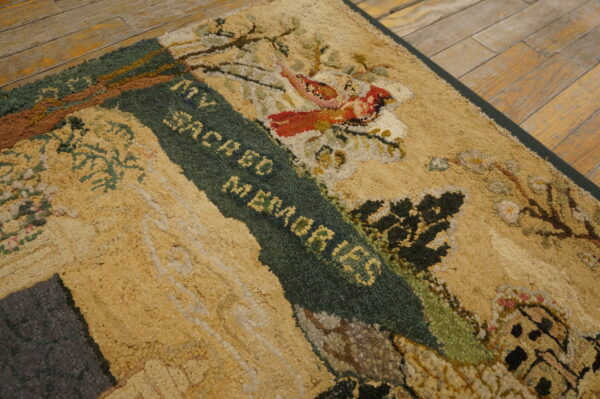 Textured, looped rug showing yellow, green, and red scenic pattern with text on rustic wood planks.