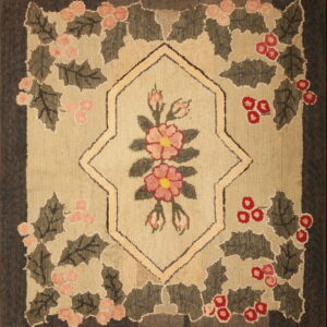 Low-pile hooked rug featuring a botanical pattern of pink and red flowers, green leaves, and a dark brown border.