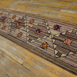 Textured runner rug with striped multicolor background and a diamond floral pattern on distressed wood planks.